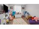 Playroom with colorful rug and beanbag chairs at 13468 Haverhill Dr, Spring Hill, FL 34609