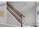 Staircase with wooden railing leading to the second floor at 13468 Haverhill Dr, Spring Hill, FL 34609