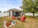 Spacious backyard with fire pit and seating, great for gatherings at 14284 Finsbury Dr, Spring Hill, FL 34609