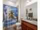 Bathroom with granite countertop, shower/tub combo at 14284 Finsbury Dr, Spring Hill, FL 34609