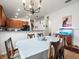 Dining area with chandelier and view of kitchen and living room at 14284 Finsbury Dr, Spring Hill, FL 34609