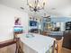 Bright dining room with chandelier and open concept floorplan at 14284 Finsbury Dr, Spring Hill, FL 34609