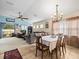 Open dining room with chandelier and view into the living room at 14284 Finsbury Dr, Spring Hill, FL 34609