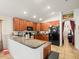 L-shaped kitchen with granite countertops and breakfast bar at 14284 Finsbury Dr, Spring Hill, FL 34609
