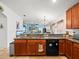 Open kitchen with granite island and stainless steel appliances at 14284 Finsbury Dr, Spring Hill, FL 34609
