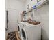Laundry room with washer, dryer, and shelving at 14284 Finsbury Dr, Spring Hill, FL 34609
