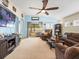 Spacious living room featuring a sliding glass door, neutral walls, and ample natural light at 14284 Finsbury Dr, Spring Hill, FL 34609