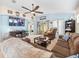 Relaxing living room with comfortable seating and a large TV at 14284 Finsbury Dr, Spring Hill, FL 34609