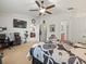 Bright main bedroom with king-size bed, a view of the backyard, and access to the bathroom at 14284 Finsbury Dr, Spring Hill, FL 34609