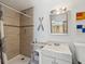 Clean bathroom with shower, vanity, and nautical accents at 2013 Gulfview Dr, Holiday, FL 34691