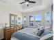 Bedroom with water views and a dresser and armchair at 2013 Gulfview Dr, Holiday, FL 34691