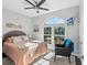 Bedroom with queen bed and large window overlooking garden at 2013 Gulfview Dr, Holiday, FL 34691