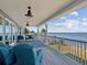 Large waterfront deck with seating area, offering scenic water views at 2013 Gulfview Dr, Holiday, FL 34691
