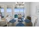 Waterfront dining area with round wooden table, and ocean views at 2013 Gulfview Dr, Holiday, FL 34691