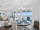 Casual dining area with round table and chairs, offering stunning water views at 2013 Gulfview Dr, Holiday, FL 34691