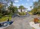 Two-story waterfront home with circular driveway and landscaping at 2013 Gulfview Dr, Holiday, FL 34691