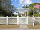 Charming home with white picket fence and welcoming entrance at 2013 Gulfview Dr, Holiday, FL 34691