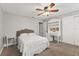 Bedroom with built-in shelving and a desk at 2418 Evenglow Ave, Spring Hill, FL 34609