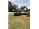 Backyard with a white vinyl fence and a large grassy area at 3039 Sandpiper Ct, Clearwater, FL 33762
