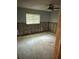 A bedroom undergoing renovation, showing exposed walls and flooring at 3039 Sandpiper Ct, Clearwater, FL 33762