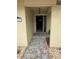 Front entry with tiled flooring and a dark-colored door at 3039 Sandpiper Ct, Clearwater, FL 33762