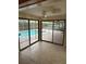 Bright interior with sliding glass doors and pool view at 3039 Sandpiper Ct, Clearwater, FL 33762