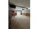 Renovation in progress: open living area with new flooring and walls at 3039 Sandpiper Ct, Clearwater, FL 33762