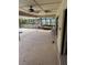 Spacious patio with ceiling fan, adjacent to the pool at 3039 Sandpiper Ct, Clearwater, FL 33762