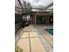 Serene patio space with pebble walkways and pool access at 3039 Sandpiper Ct, Clearwater, FL 33762