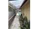 Pathway to a screened-in pool area with pool equipment at 3039 Sandpiper Ct, Clearwater, FL 33762