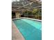Sparkling pool with screened enclosure and patio at 3039 Sandpiper Ct, Clearwater, FL 33762
