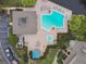 Community pool with lounge chairs and a spa at 3053 Landmark Blvd # 1104, Palm Harbor, FL 34684