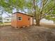 Backyard shed for extra storage with tree coverage at 3519 Eisenhower Dr, Holiday, FL 34691