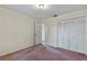 Bedroom with double door closet and carpet at 3820 59Th W Ave # 3820, Bradenton, FL 34210