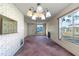 Dining room with chandelier and access to patio at 3820 59Th W Ave # 3820, Bradenton, FL 34210