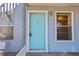 Front door view of a teal door at 3820 59Th W Ave # 3820, Bradenton, FL 34210