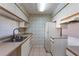 Kitchen with white cabinets and double sink at 3820 59Th W Ave # 3820, Bradenton, FL 34210