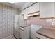 Kitchen with refrigerator and white cabinets at 3820 59Th W Ave # 3820, Bradenton, FL 34210