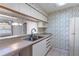 Kitchen with double sink and white cabinets at 3820 59Th W Ave # 3820, Bradenton, FL 34210