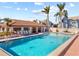 Community pool with lounge chairs and patio area at 3820 59Th W Ave # 3820, Bradenton, FL 34210