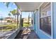 Screened porch entrance with view of community amenities at 3820 59Th W Ave # 3820, Bradenton, FL 34210