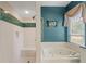 Bathroom with a separate shower and tub, ideal for relaxation at 4412 Lake In The Woods Dr, Spring Hill, FL 34607