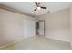 Bedroom with double door closet and ceiling fan at 4412 Lake In The Woods Dr, Spring Hill, FL 34607