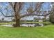 Serene backyard setting overlooking a peaceful lake at 4412 Lake In The Woods Dr, Spring Hill, FL 34607