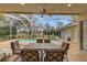 Inviting screened pool area with patio furniture at 4412 Lake In The Woods Dr, Spring Hill, FL 34607
