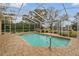 Inviting screened-in pool with paved patio area at 4412 Lake In The Woods Dr, Spring Hill, FL 34607