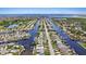 Aerial view of canal-front home and neighborhood at 4424 Floramar Ter, New Port Richey, FL 34652