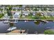 Aerial view showcasing canal-front property and boats at 4424 Floramar Ter, New Port Richey, FL 34652
