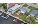 Aerial view of waterfront home with private pool and boat dock at 4424 Floramar Ter, New Port Richey, FL 34652