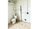 Unfinished bathroom with toilet and shelving at 4424 Floramar Ter, New Port Richey, FL 34652